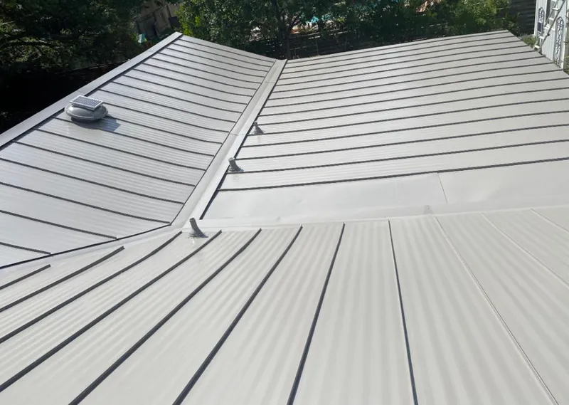 Solar attic fan installed on a metal roof for Roof Ventilation in Pembroke Pines